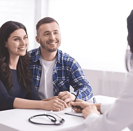 Couple consulting fertility specialist about egg freezing