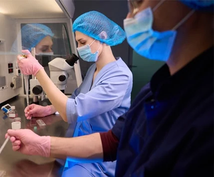 Doctor performing in vitro fertilization lab test